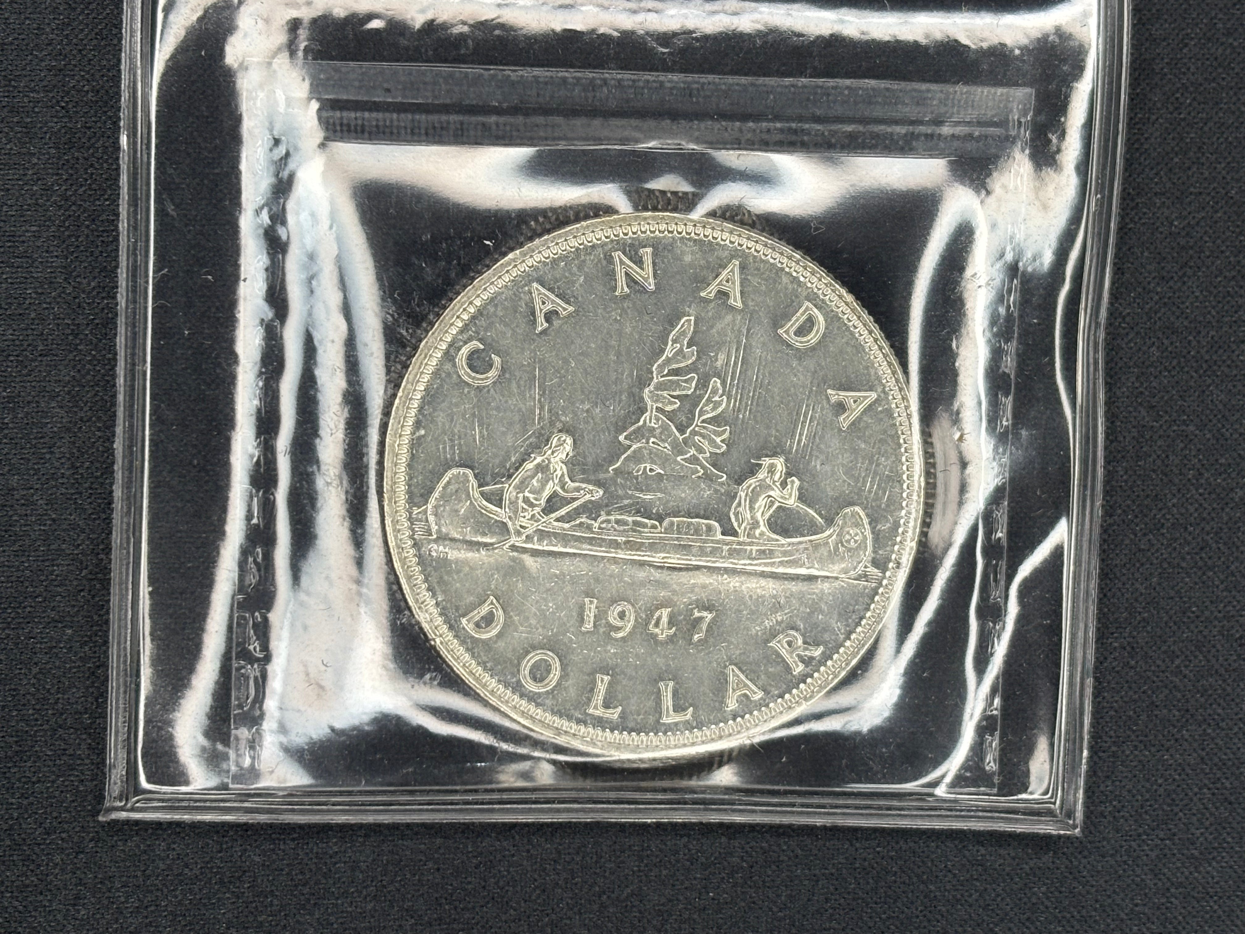 Canadian Silver Coin - Dollar - 1947 Blunt 7 - AU55 ICCS