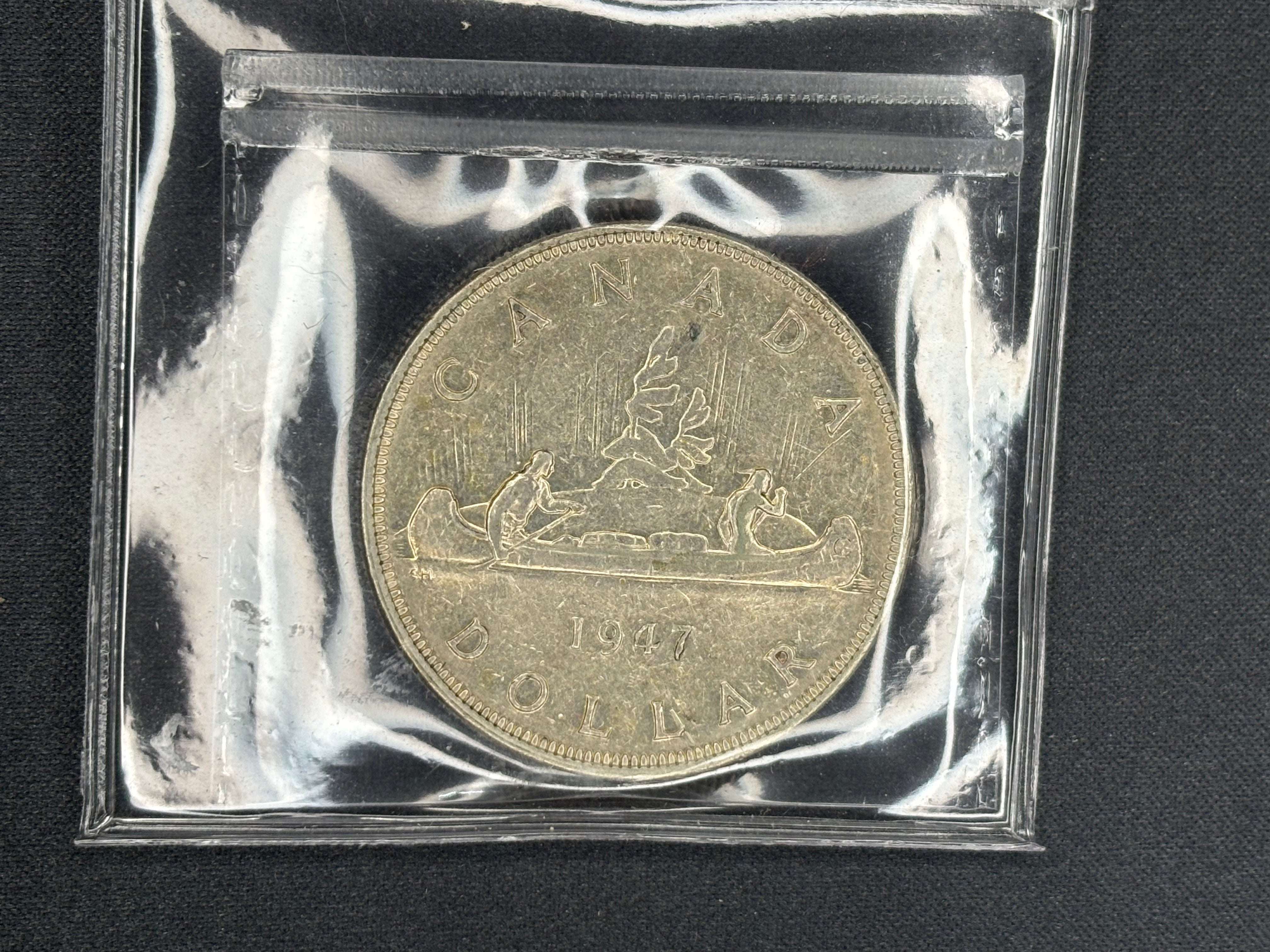 Canadian Silver Coin - Dollar - 1947 Pointed 7 - VF30 ICCS